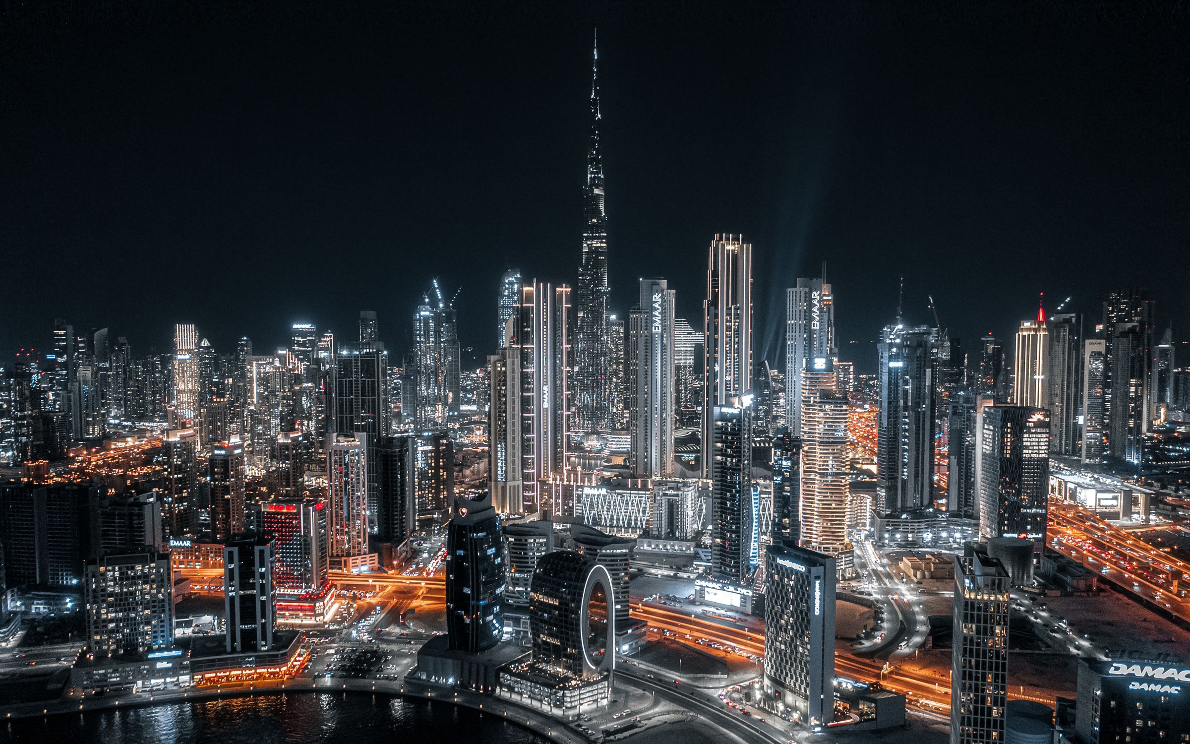 Dubai skyline at night with Burj Khalifa and Business Bay towers illuminated